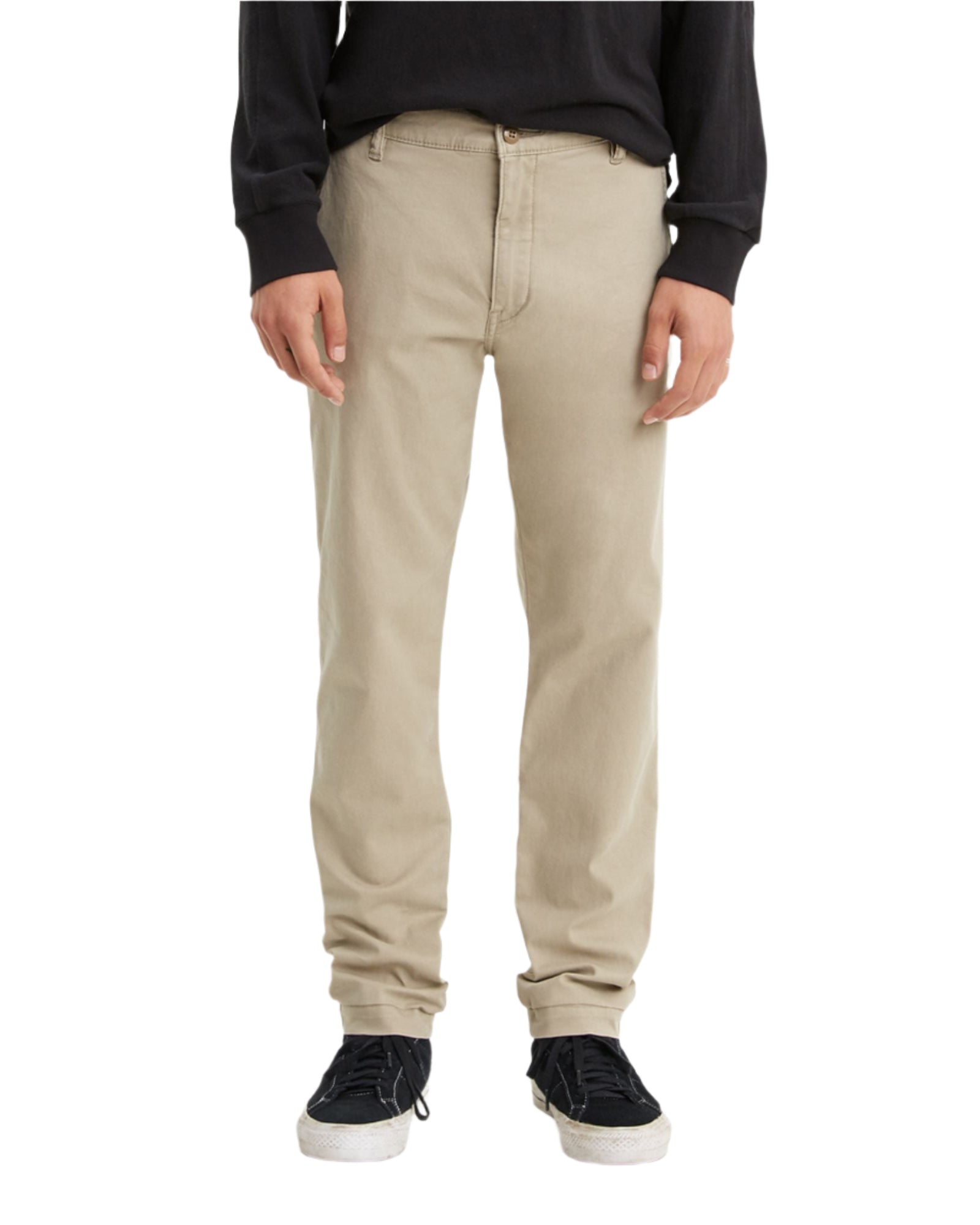 Person wearing beige pants on a white background