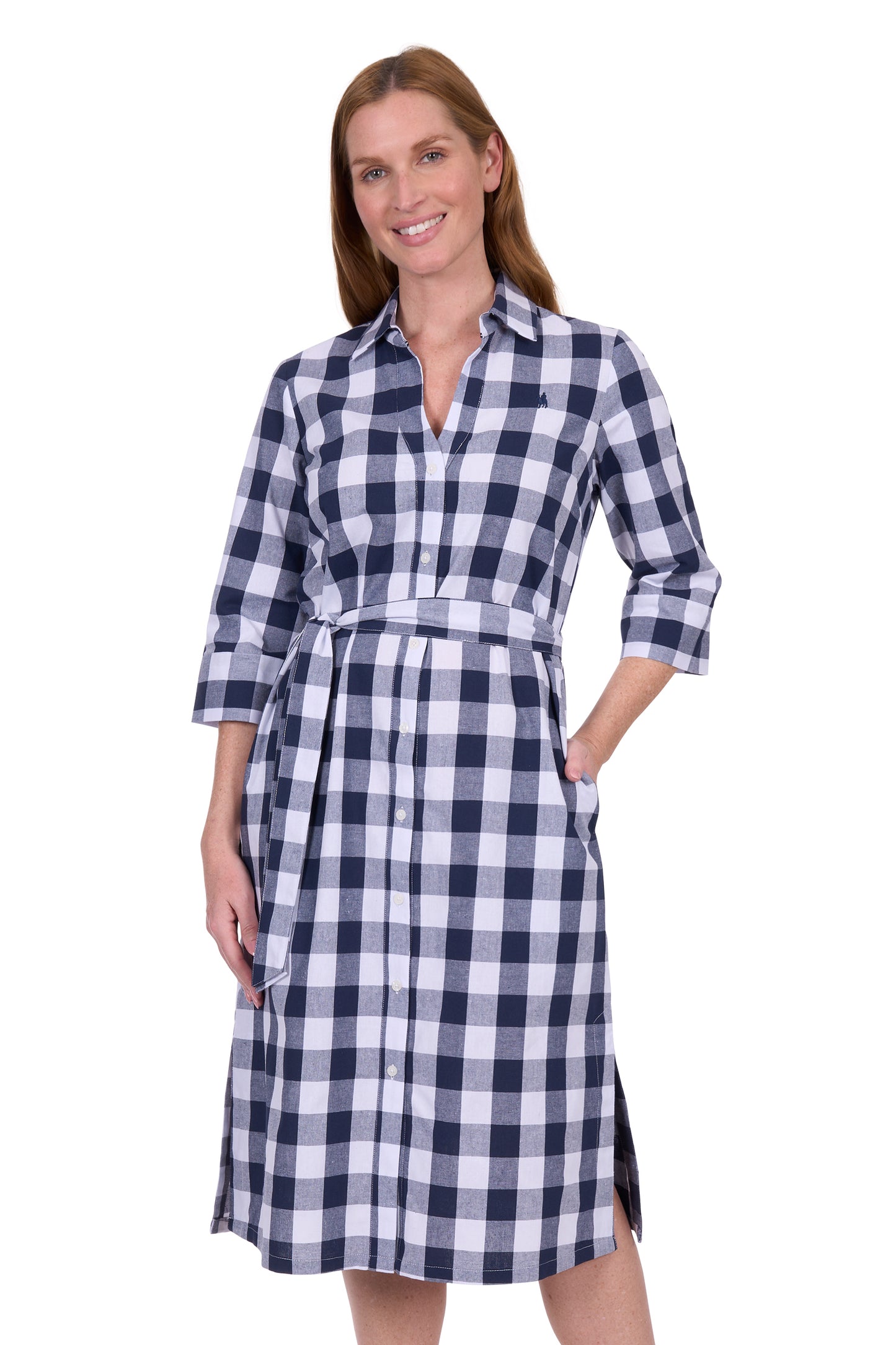 Woman wearing a blue and white checkered dress on a white background