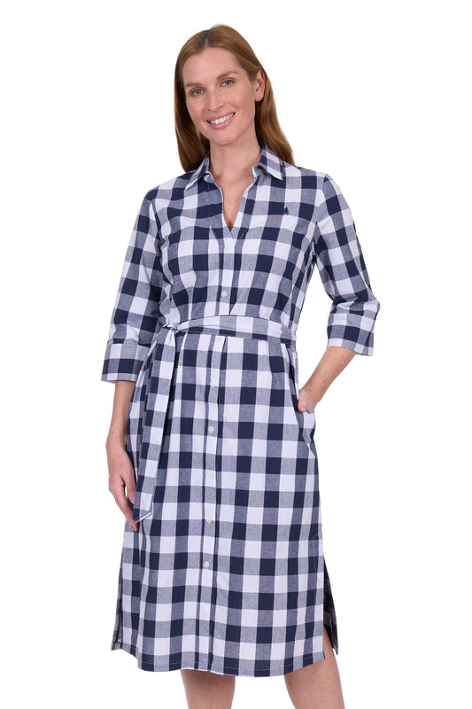 Woman wearing a blue and white checkered dress on a white background